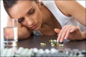 woman counting pills